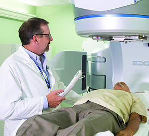 image of radiation therapist with patient