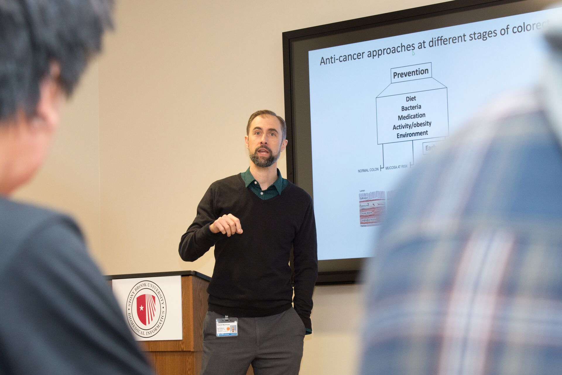 Researcher presents to students