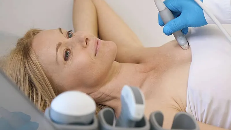 Woman having a breast ultrasound exam