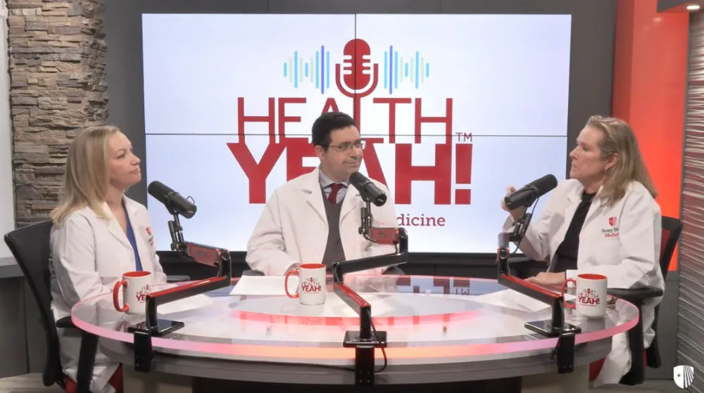 Doctors sitting at the podcast table.